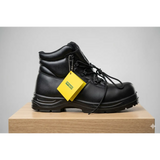 Tuffsafe men’s black steel toe safety work boot with black leather, rugged sole, laces, and yellow side tag